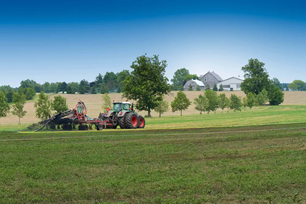 Tractor top spreading a hay field